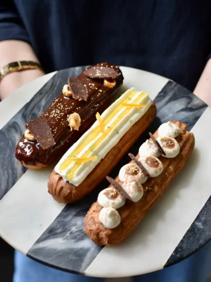 Assorted eclairs of set 3 add-ons from Maska bakery held on a plate